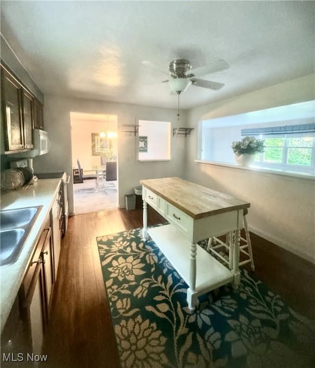 1104 Lantern, East Liverpool, OH 43920 - kitchen with dark wood-type flooring, ceiling fan, wood counters, and dark brown cabinetry