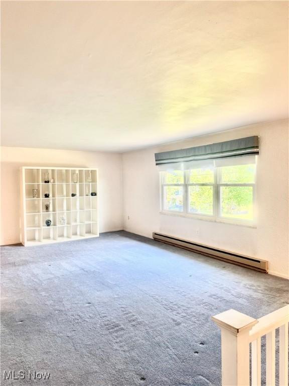 1104 Lantern, East Liverpool, OH 43920 - carpeted spare room featuring a baseboard radiator