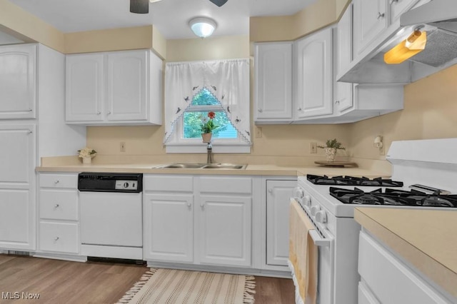 4706 Lansing Dr, North Olmsted, OH 44070 - kitchen with white appliances, under cabinet range hood, white cabinets, light countertops, and light wood-style floors