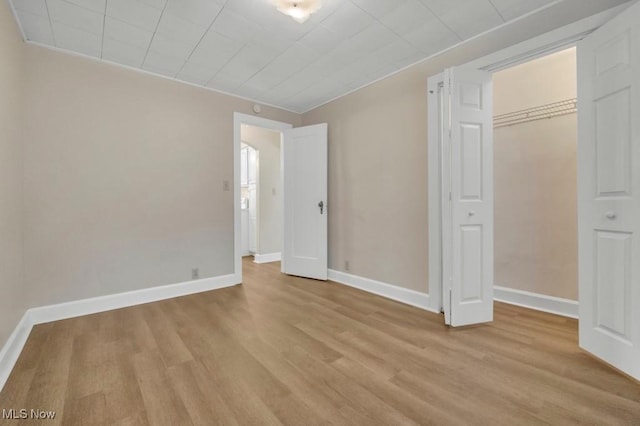 4706 Lansing Dr, North Olmsted, OH 44070 - unfurnished bedroom with light wood finished floors and a closet