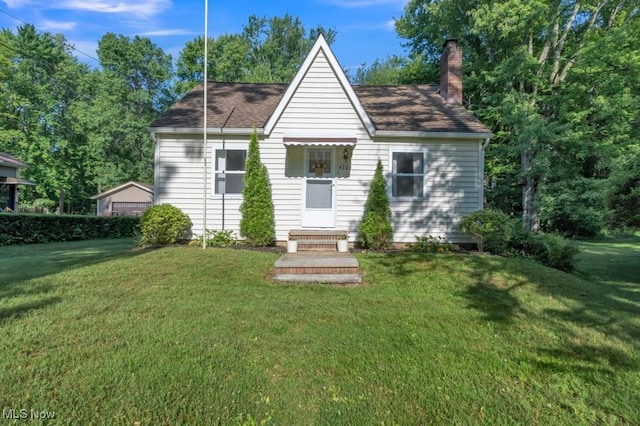 4706 Lansing Dr, North Olmsted, OH 44070 - view of front of house featuring a front lawn and a chimney