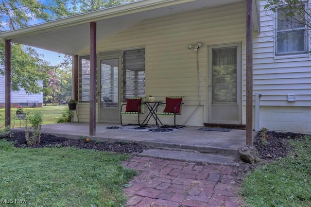 4706 Lansing Dr, North Olmsted, OH 44070 - view of exterior entry featuring a yard and a patio
