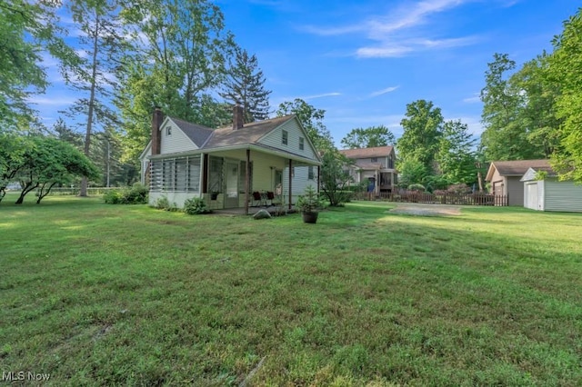 4706 Lansing Dr, North Olmsted, OH 44070 - view of yard with an outbuilding and a porch