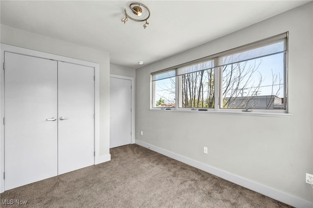 11901 Detroit Ave, Lakewood, OH 44107 - unfurnished bedroom featuring carpet and a closet