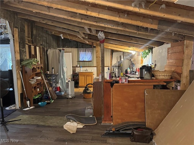 604 Pear Dr, Akron, OH 44319 - below grade area featuring gas water heater and wood finished floors