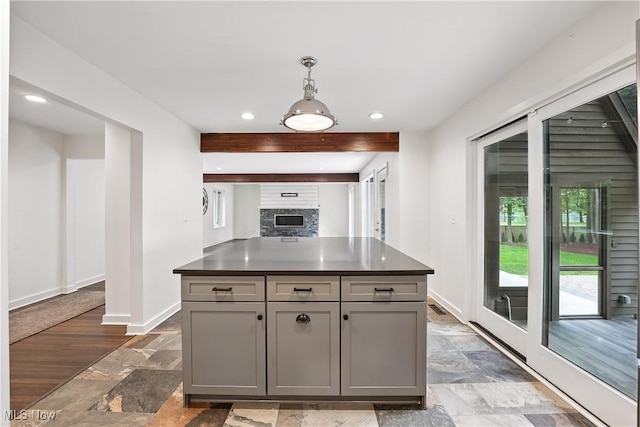 263 E Pne Lake Rd, North Lima, OH 44452 - kitchen featuring gray cabinetry, stone tile floors, dark countertops, recessed lighting, and decorative light fixtures