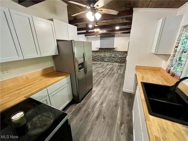 4807 Laskey Rd, Rome, OH 44085 - kitchen with a wooden ceiling with exposed beams, stainless steel refrigerator with ice dispenser, a ceiling fan, butcher block countertops, and white cabinets