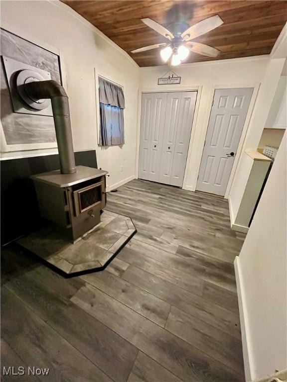4807 Laskey Rd, Rome, OH 44085 - foyer entrance featuring wood ceiling, a ceiling fan, dark wood finished floors, and a wood stove