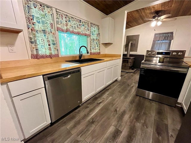 4807 Laskey Rd, Rome, OH 44085 - kitchen featuring stainless steel appliances, wooden ceiling, wooden counters, white cabinetry, and ceiling fan