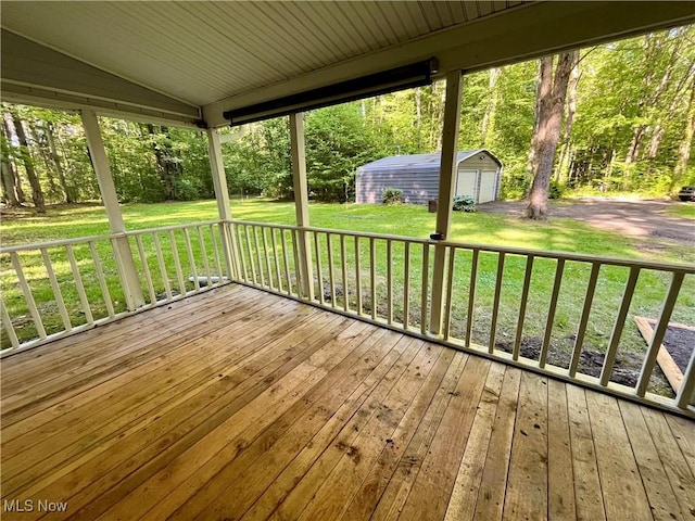 4807 Laskey Rd, Rome, OH 44085 - wooden deck with a storage shed, a garage, and a lawn