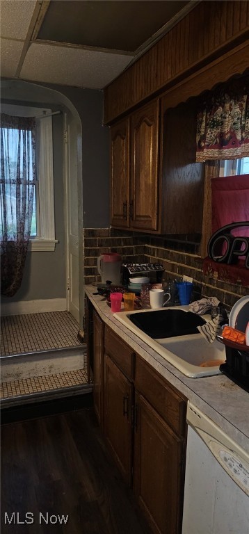 425 N Osborn Ave, Youngstown, OH 44509 - kitchen featuring dishwasher, light countertops, dark wood-style flooring, and arched walkways