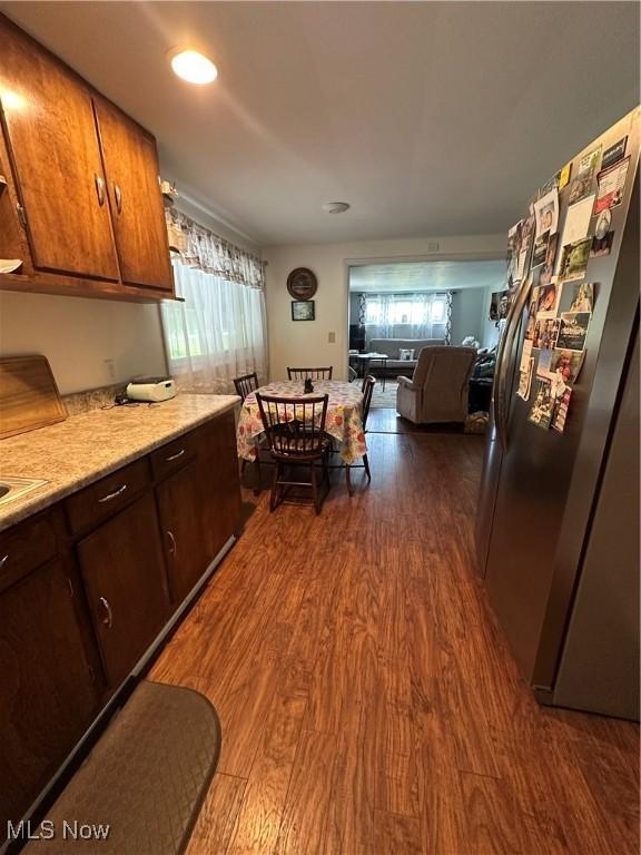 3028 Amsterdam Rd SE, Scio, OH 43988 - kitchen featuring stainless steel fridge with ice dispenser, dark wood-style flooring, and open floor plan