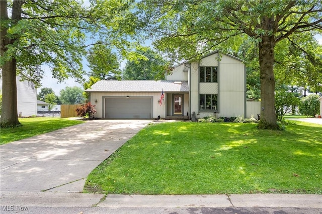 1558 Windcrest St NW, North Canton, OH 44720 - view of front of house featuring an attached garage and concrete driveway