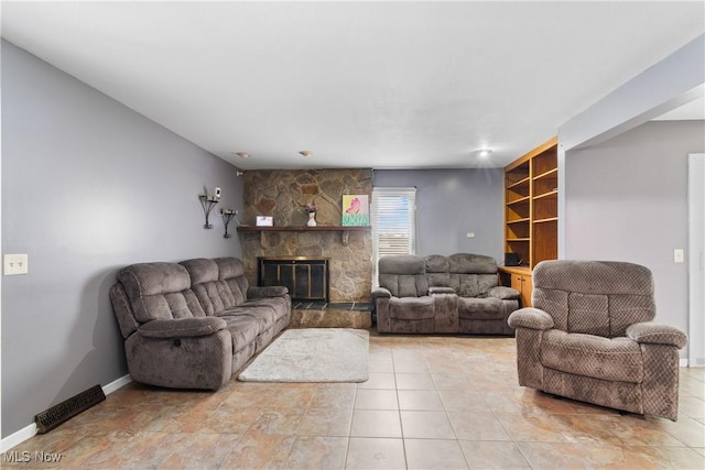1558 Windcrest St NW, North Canton, OH 44720 - living area with a fireplace and light tile patterned flooring