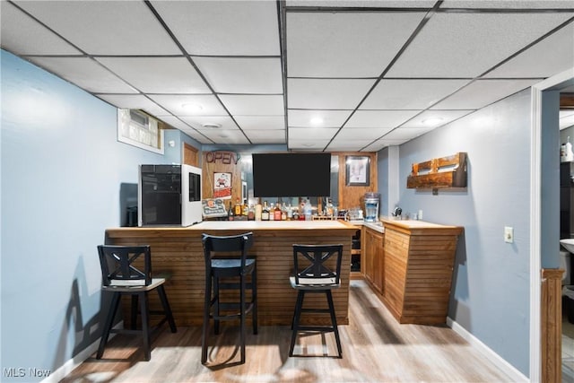 1558 Windcrest St NW, North Canton, OH 44720 - indoor bar featuring light wood-type flooring, recessed lighting, and a drop ceiling