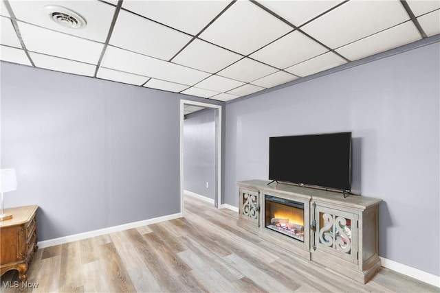 1558 Windcrest St NW, North Canton, OH 44720 - living area featuring a drop ceiling and wood finished floors