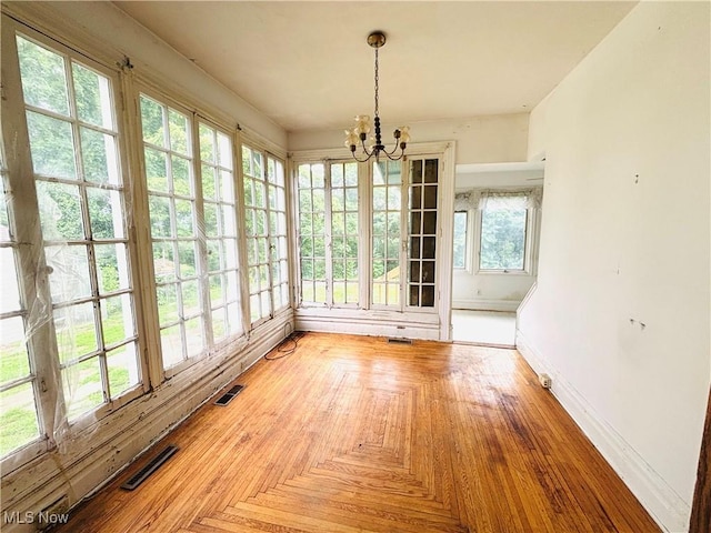1709 Washington Blvd, Belpre, OH 45714 - unfurnished sunroom with a chandelier and french doors