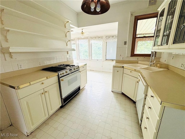 1709 Washington Blvd, Belpre, OH 45714 - kitchen featuring white appliances, open shelves, backsplash, crown molding, and light countertops