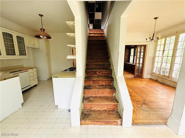 1709 Washington Blvd, Belpre, OH 45714 - stairs featuring a chandelier