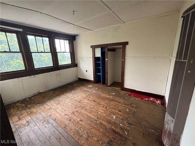 1709 Washington Blvd, Belpre, OH 45714 - unfurnished bedroom with wood-type flooring and a heating unit