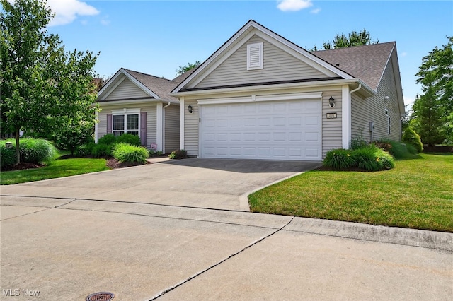 498 Water Pointe Ln, Brunswick, OH 44212 - ranch-style home with concrete driveway, a garage, a front lawn, and a shingled roof