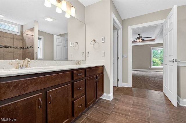 498 Water Pointe Ln, Brunswick, OH 44212 - bathroom featuring double vanity, a tile shower, ceiling fan, and tile patterned flooring