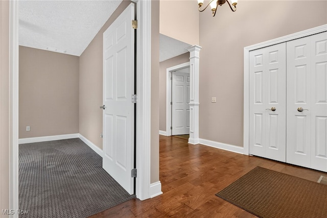 498 Water Pointe Ln, Brunswick, OH 44212 - entrance foyer featuring wood finished floors, a textured ceiling, and a chandelier