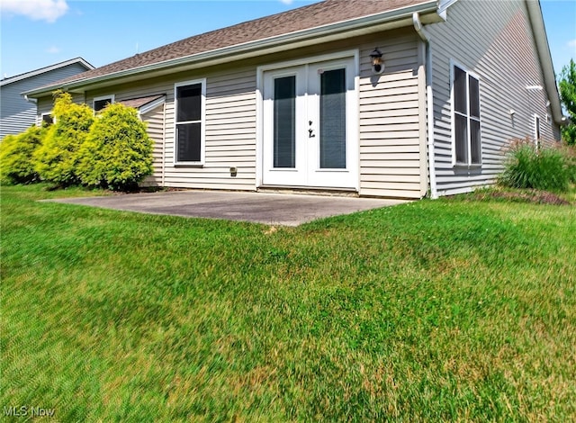 498 Water Pointe Ln, Brunswick, OH 44212 - rear view of house featuring a lawn, a patio area, and french doors