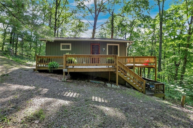 11140 Andrus Dr, Glouster, OH 45732 - view of front of home featuring a deck, stairway, and board and batten siding