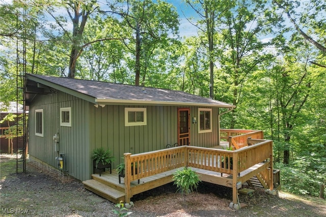 11140 Andrus Dr, Glouster, OH 45732 - back of property with roof with shingles and a wooden deck