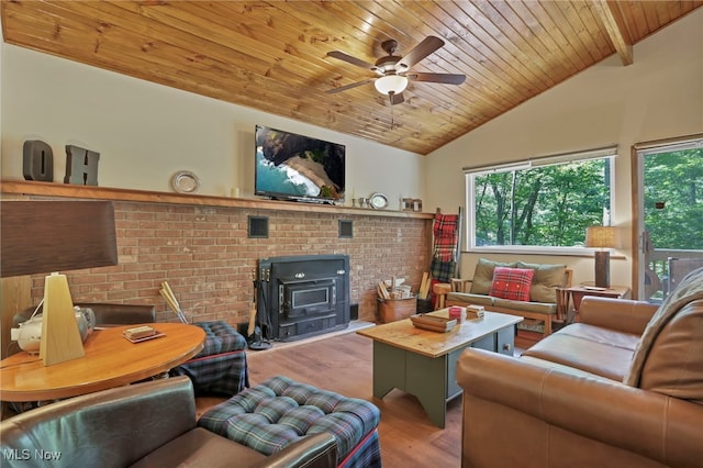 11140 Andrus Dr, Glouster, OH 45732 - living area with a wood stove, wood finished floors, wood ceiling, lofted ceiling, and ceiling fan