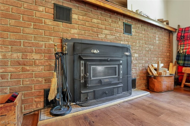 11140 Andrus Dr, Glouster, OH 45732 - detailed view of a wood stove and wood finished floors