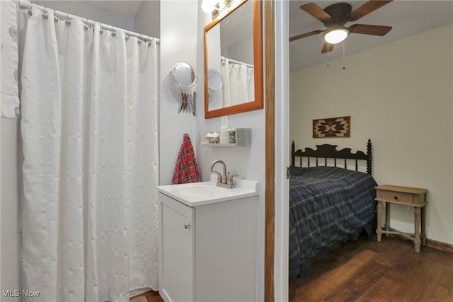 11140 Andrus Dr, Glouster, OH 45732 - full bath featuring vanity, a ceiling fan, and wood finished floors