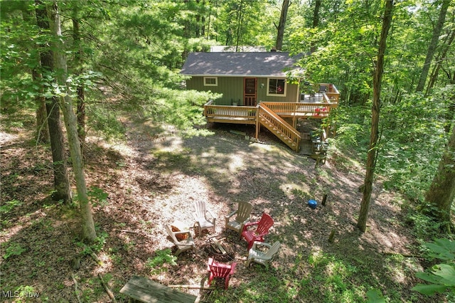 11140 Andrus Dr, Glouster, OH 45732 - rear view of house with a wooden deck, a fire pit, and a forest view