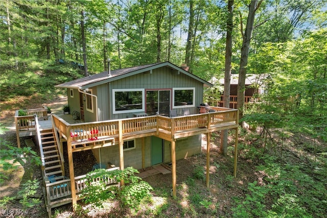 11140 Andrus Dr, Glouster, OH 45732 - view of front facade with a wooden deck and stairway