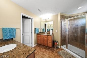 8028 Megan Meadow Dr, Hudson, OH 44236 - bathroom with two vanities, a stall shower, and tile patterned floors