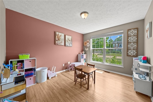 866 Brightwood Ct, Brunswick, OH 44212 - playroom featuring wood finished floors and a textured ceiling
