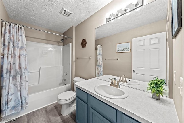 866 Brightwood Ct, Brunswick, OH 44212 - full bathroom featuring wood finished floors, shower / tub combo with curtain, vanity, and a textured ceiling