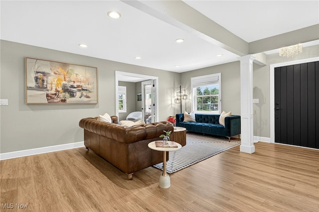 14370 Washington Blvd, University Heights, OH 44118 - living area with light wood-type flooring, ornate columns, and recessed lighting