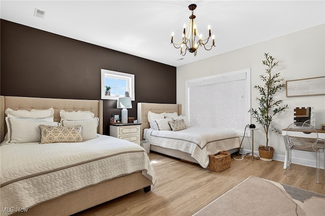 14370 Washington Blvd, University Heights, OH 44118 - bedroom featuring a chandelier and wood finished floors