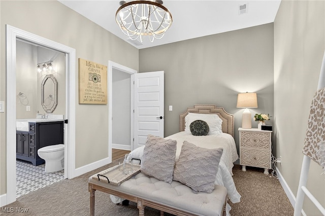14370 Washington Blvd, University Heights, OH 44118 - carpeted bedroom featuring a chandelier and ensuite bathroom