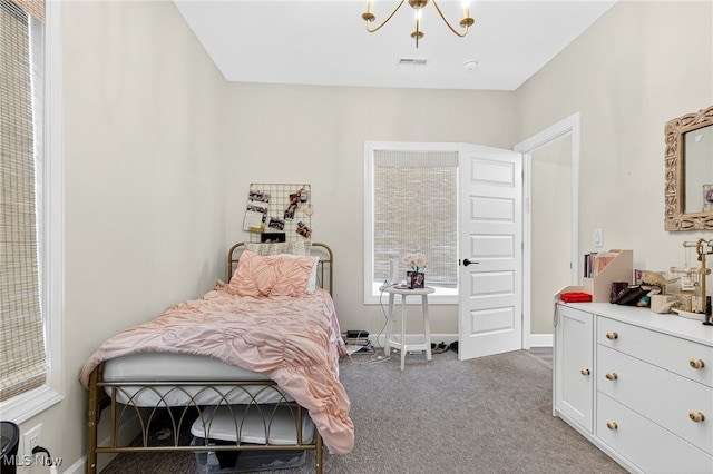 14370 Washington Blvd, University Heights, OH 44118 - carpeted bedroom with a chandelier and baseboards