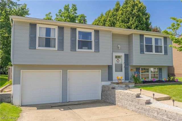 4950 Trafalgar St SW, Canton, OH 44706 - bi-level home with a garage and driveway