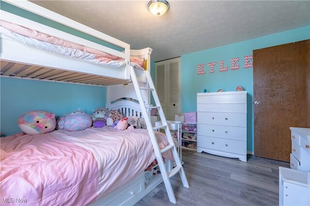 4950 Trafalgar St SW, Canton, OH 44706 - bedroom featuring wood finished floors and a closet
