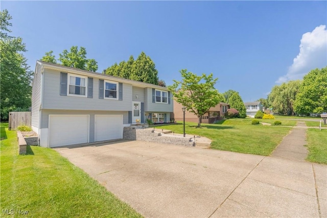 4950 Trafalgar St SW, Canton, OH 44706 - bi-level home featuring an attached garage, a front yard, and concrete driveway