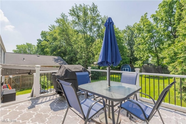 4950 Trafalgar St SW, Canton, OH 44706 - view of patio with outdoor dining area and a storage unit