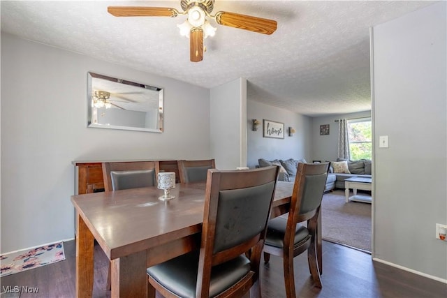 4950 Trafalgar St SW, Canton, OH 44706 - dining space featuring a textured ceiling, ceiling fan, and dark wood finished floors