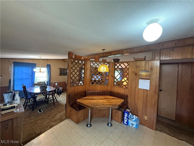 44534 US Highway 36, Coshocton, OH 43812 - rec room featuring a textured ceiling, a chandelier, wooden walls, light floors, and light carpet