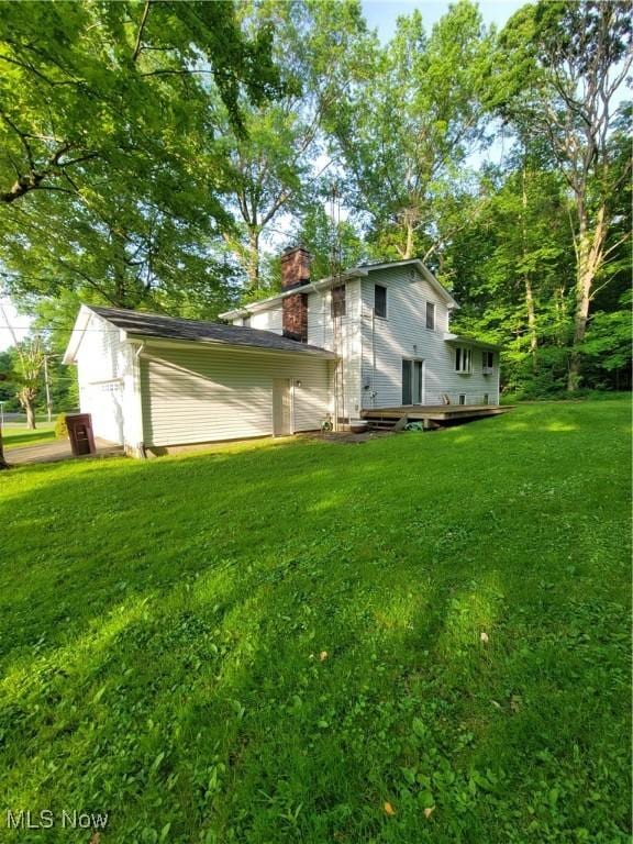 5622 Donna Dr, Ashtabula, OH 44004 - view of side of property with a chimney and a yard