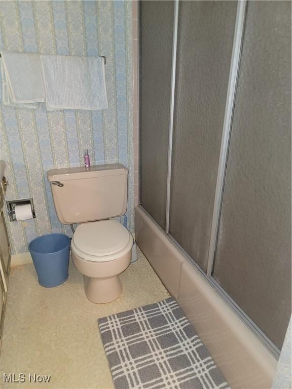5622 Donna Dr, Ashtabula, OH 44004 - bathroom with shower / bath combination with glass door and wallpapered walls